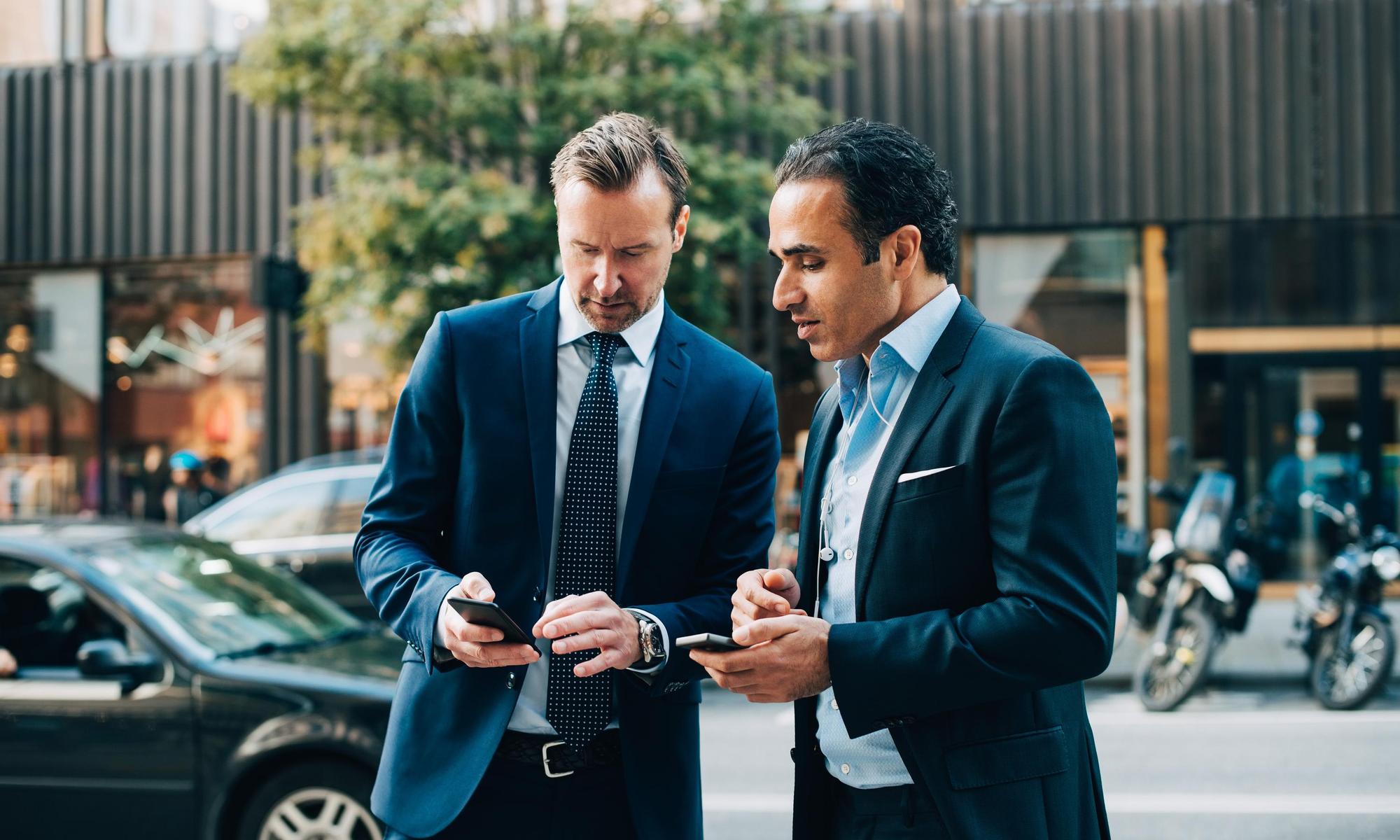 Two men in suits having a meeting